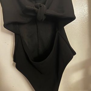 Black Bow Down Cut Out Bodysuit. Ties in the front